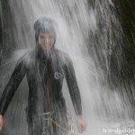 passing under a waterfall