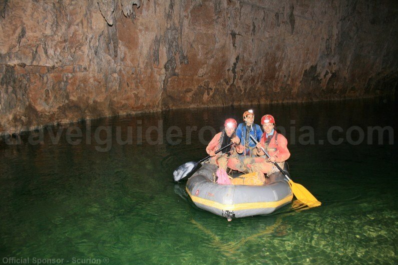 Passing an underground lake with inflatable boat