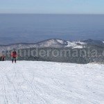 Winter trek from Stana de Vale resort to Poieni peak